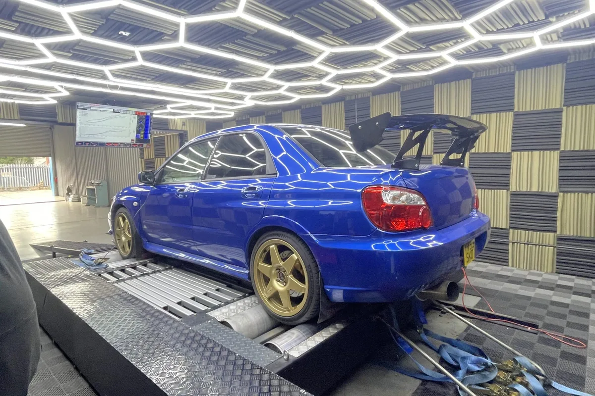 Blue Subaru Impreza being tuned on the MB Developments four-wheel-drive dyno