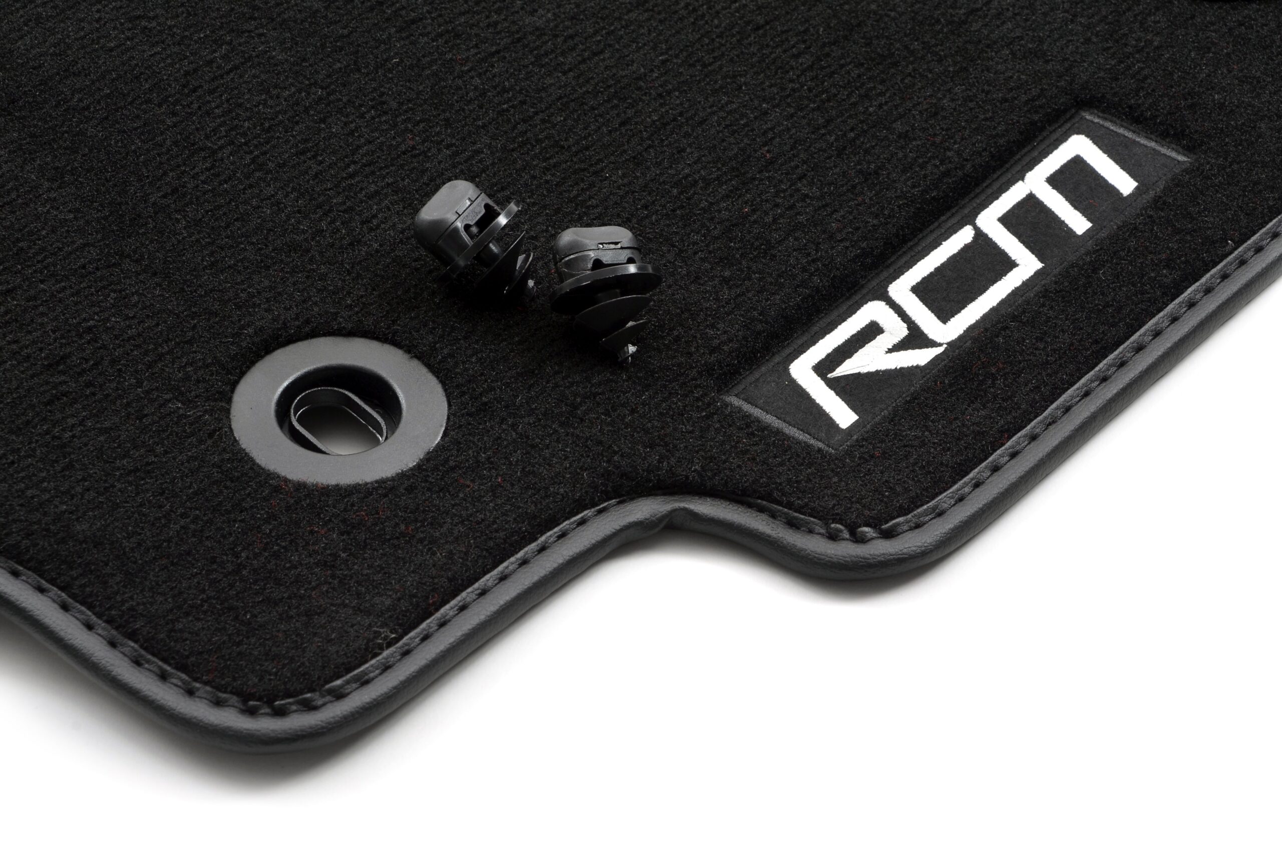 RCM 2-door Subaru Impreza 1996–2001 luxury mat set – alternate view RCM SPE247 embroidered logo and bound edge close-up