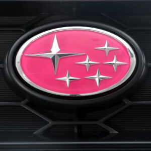 Pink Subaru STI SST17 stars badge fitted to an illustrative grille; grille not included