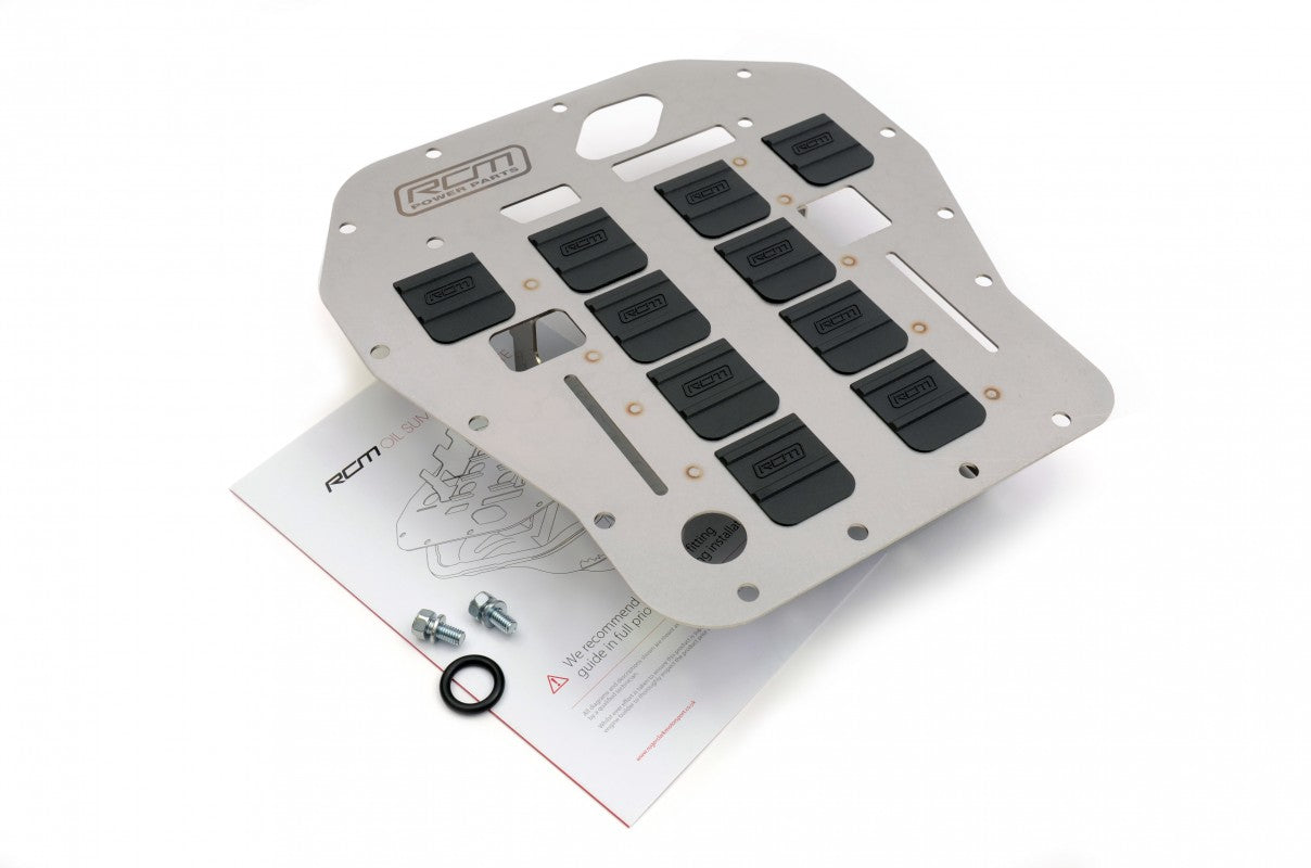 RCM2428 – supplier view 5 RCM2428 oil sump pan baffle plate photographed with packaged fitting items